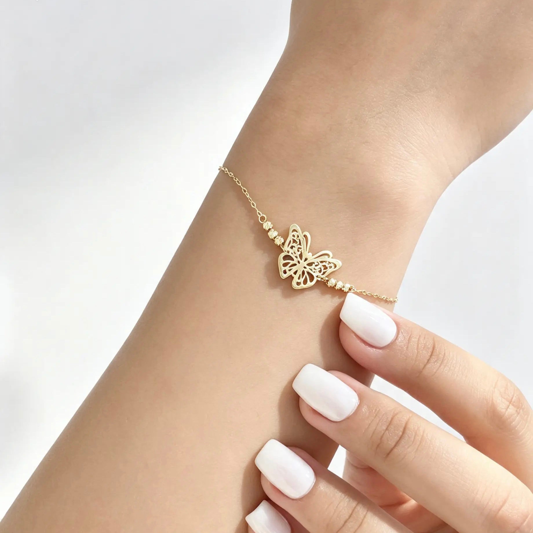 Gourmette papillon Or 18K